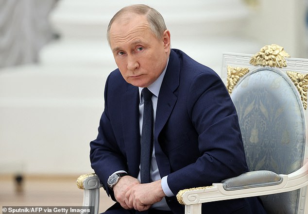 Vladimir Putin looks on as he holds a meeting of the Supervisory Board of the Russia - Land of Opportunity platform at the Catherine's Hall of the Kremlin in Moscow on April 20, 2022.