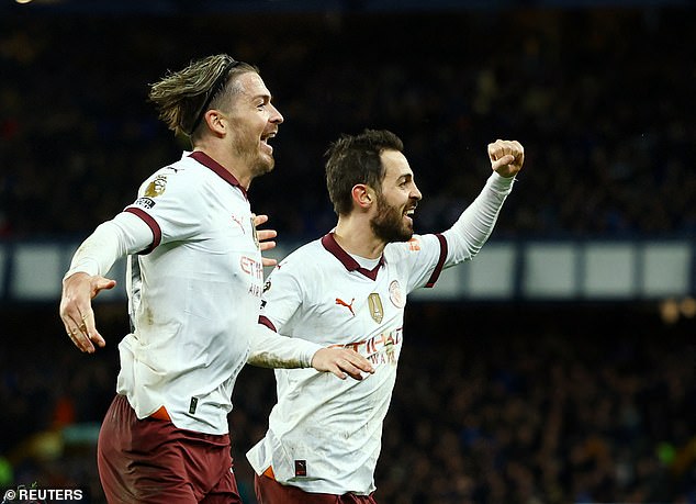 Jack Grealish (left, with Bernardo Silva) plays in the match between Manchester City and Everton on Wednesday evening.  Thieves raided his home while his family was watching the game