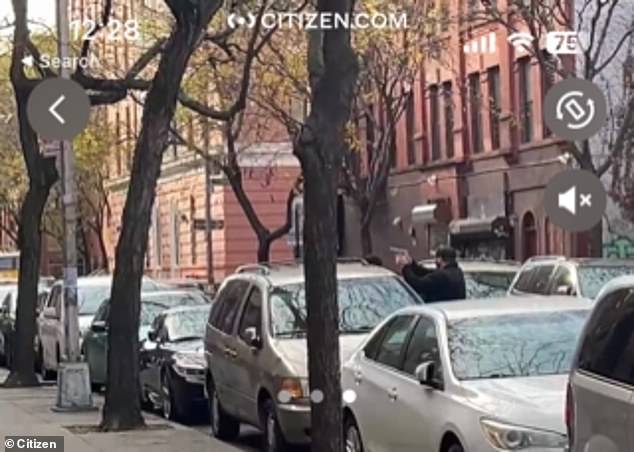 Reports say shots were fired after a man barricaded himself inside a midtown Manhattan apartment on Thursday