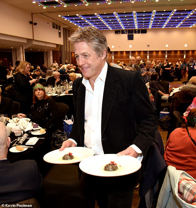 Hugh Grant was spotted serving Christmas dinner to his London neighbors at the Big H&F Christmas Day Lunch