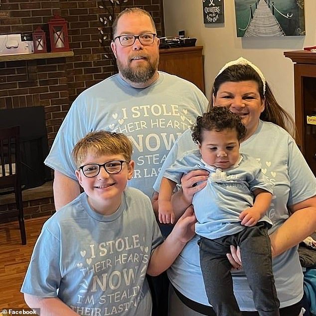 Mrs. Carlisle is pictured on the left with her biological son, with her husband standing behind.  Sammy started out as their foster son, but the Carlisles adopted him in February