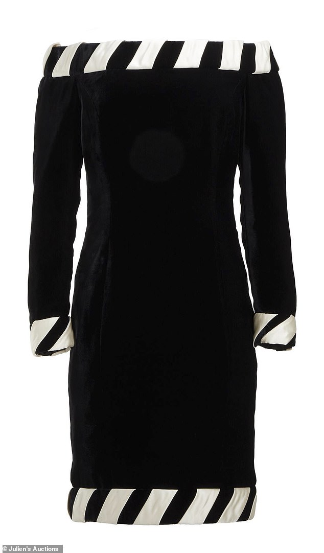 A black silk velvet cocktail dress worn by Princess Diana, designed by Catherine Walker, is one of the largest items up for bid and is estimated to fetch between $100,000 and $200,000.