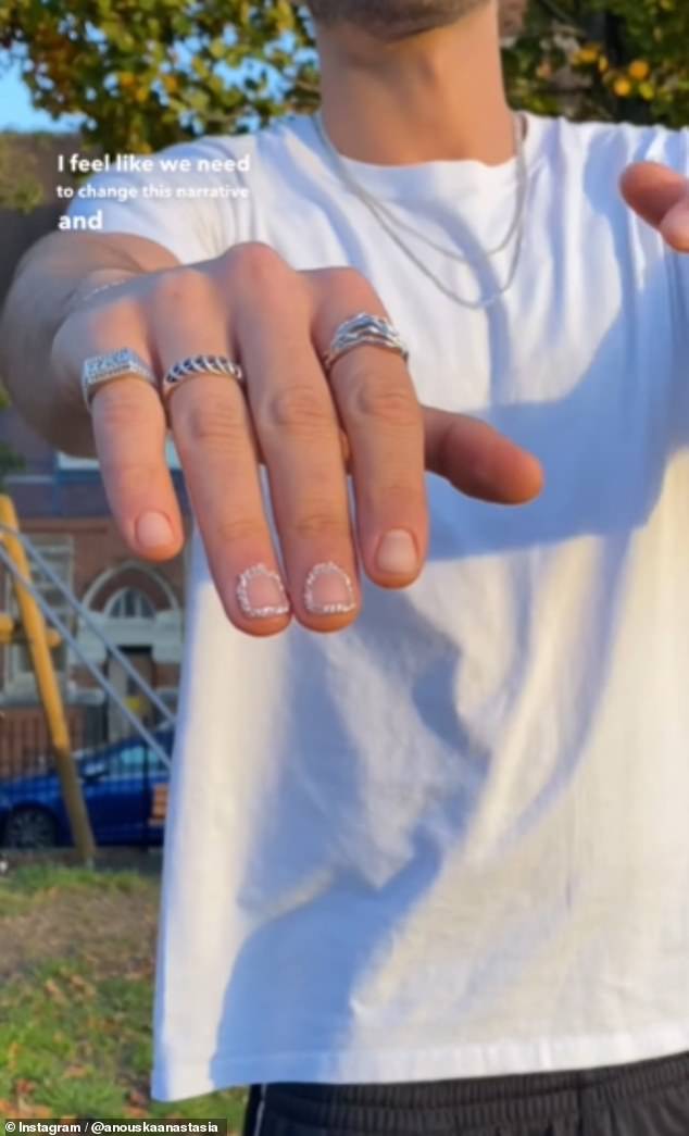 A nail technician has divided opinion on Instagram after sharing a unique manicure trend she designed for her male client (pictured: an unnamed man poses with his newly styled 'Chained Windows Men's Mani')