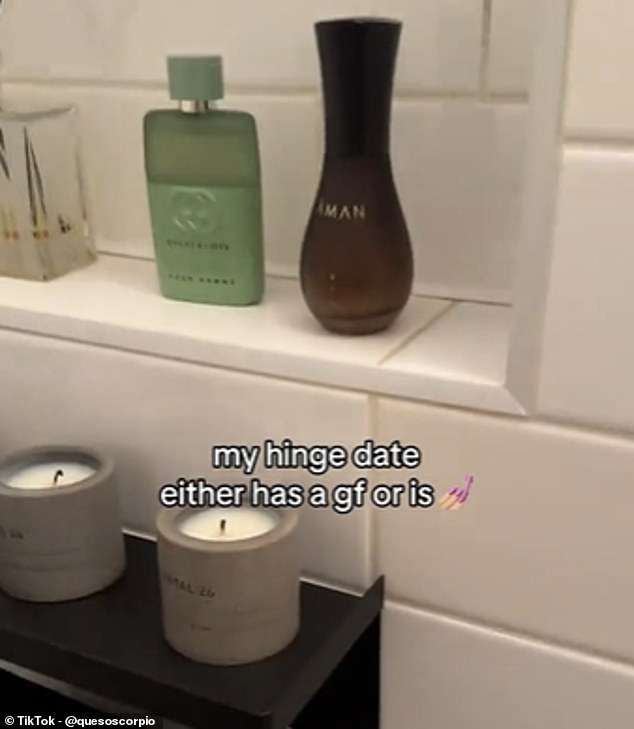 A set of three Le Labo Santal 26 scented candles were displayed on top of the toilet tank, next to a reed diffuser and bottles of designer perfume