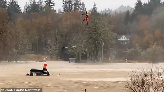 A terrified motorist who became stuck on top of his truck when raging waters threatened to submerge him has been rescued in a dramatic helicopter mission