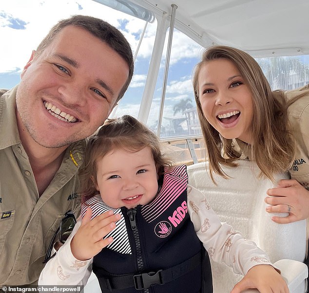 It looks like Bindi Irwin will be moving from sunny Queensland to sunny Florida.  Rumor has it that the Wildlife Warrior, 25, is exploring her options to move her family to the United States.  (Pictured with husband Chandler Powell and daughter Grace Warrior)