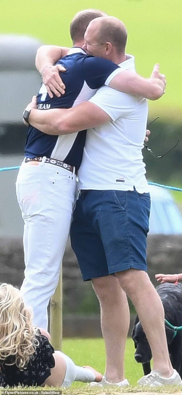 Mike Tindall and Prince William show their close bond and share a warm hug during a charity polo match in 2017