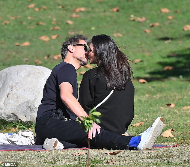 Ioan Gruffudd and his girlfriend Bianca Wallace appeared carefree as they cuddled in a park on Friday