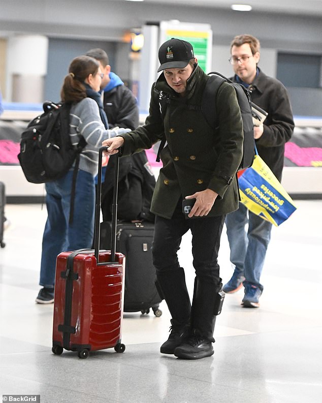 Jeremy Renner was spotted wearing air compression sleeves on his calves at JFK Airport in New York City on Wednesday