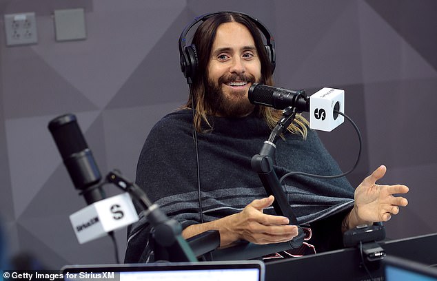 The 51-year-old 30 Seconds to Mars frontman wore a black poncho-like covering with white stripes that he kept wrapped around his body during the interview