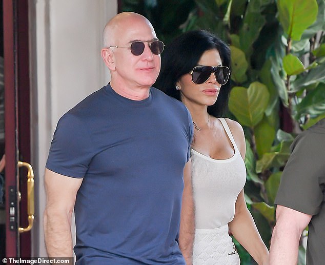 Bezos, 59, and Sanchez, 53, were spotted looking at art installations on the beach before heading to the famous Joe's Stone Crab for a late lunch