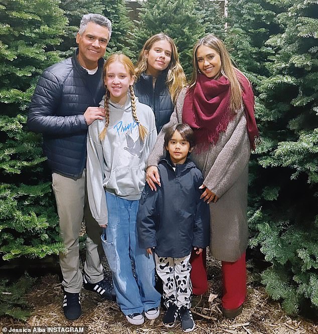 Jessica Alba's daughters, Honor, 15, and Haven, 12, look almost as tall as their 6-foot-4" mom as they pose for a family vacation photo with dad Cash Warren, 44, and younger brother Hayes, five.  'It's that time of year!  Xo,” Jessica, 42, wrote next to the photo