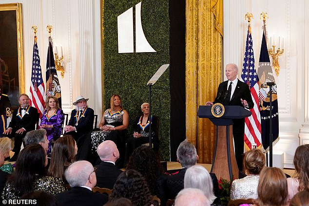 President Joe Biden celebrated the five Kennedy Center Honors honorees at the White House on Sunday evening with brief remarks about each.  From left: actor and comedian Billy Crystal;  opera and theater soprano Renée Fleming;  British singer-songwriter and member of the Bee Gees, Barry Gibb;  rapper, singer and actress Queen Latifah;  singer Dionne Warwick and President Biden