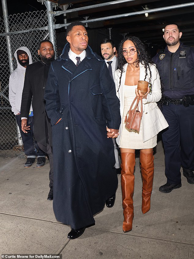 Audio has been released in the trial of Jonathan Majors, showing him berating his ex-girlfriend Grace Jabbari for not living up to the standards of Coretta Scott King and Michelle Obama.  Pictured: Majors leaves court on Wednesday with his new girlfriend Meagan Good