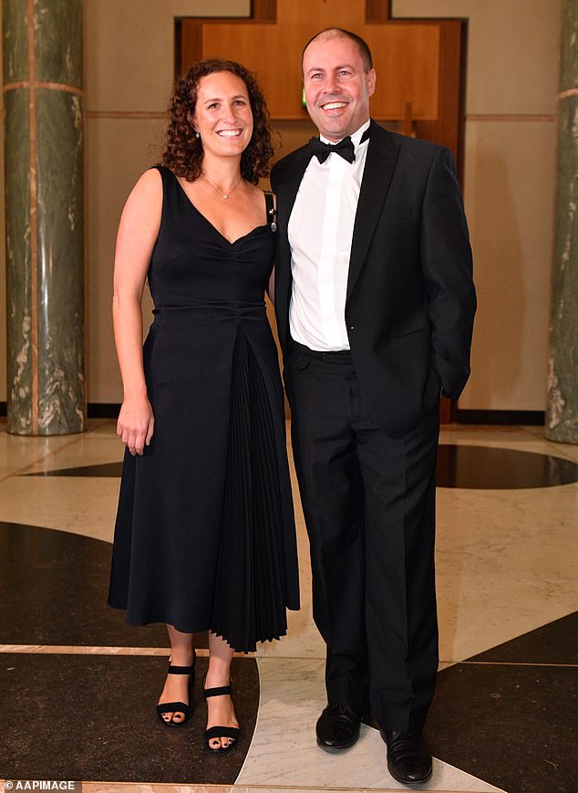 Former federal treasurer Josh Frydenberg (pictured with wife Amie) is said to be considering reclaiming his old seat of Kooyong in Melbourne