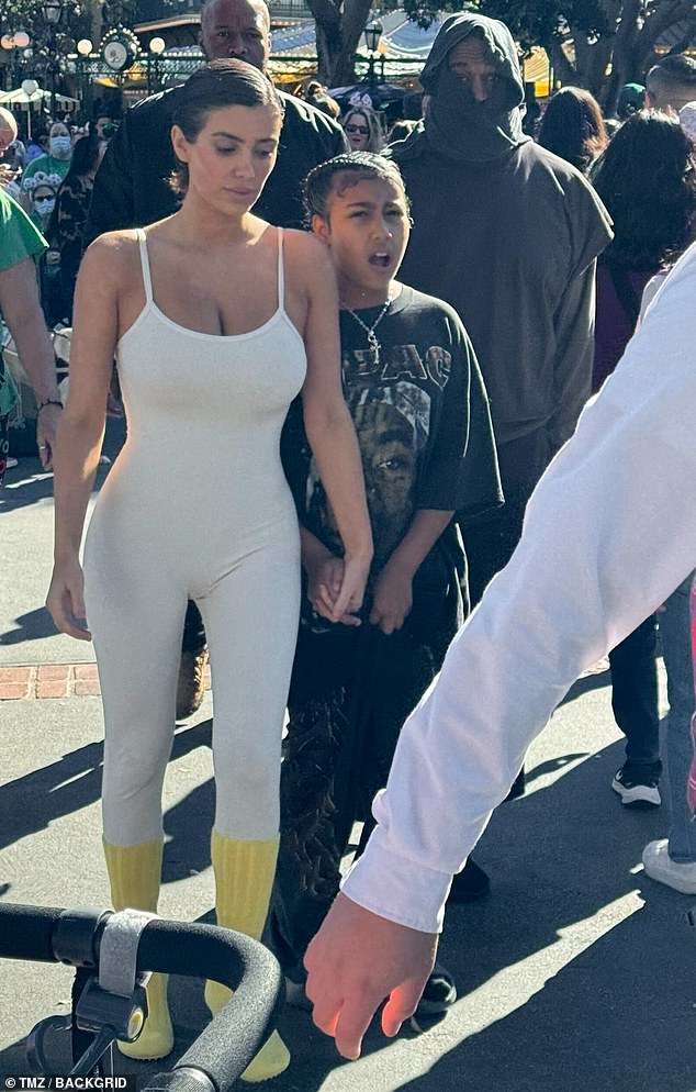 Kanye West and his wife Bianca Censori – wearing a low-cut leotard – were spotted taking his 10-year-old daughter north to Disneyland on Thursday