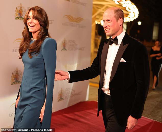 Judi pointed to Prince William's 'steering hand' as he 'introduces his beautiful wife to the world' as they arrive on the red carpet
