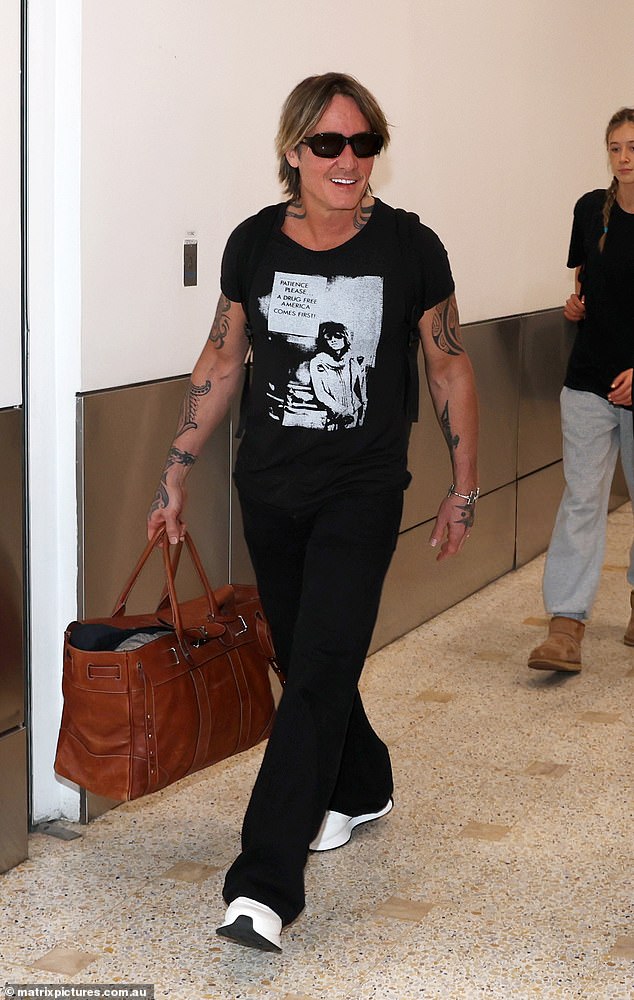Keith Urban, 55, (pictured) returned home to Sydney, Australia, without his beloved wife Nicole Kidman on Monday ahead of the holidays