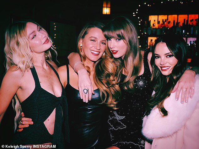 She shared a photo of her posing with Taylor, Zoe Kravitz and husband Miles Teller as they walked around a bar