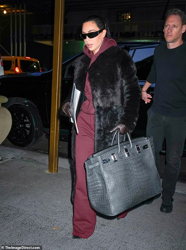 Kim Kardashian was spotted entering a building in New York City on Thursday evening wearing her thin black sunglasses