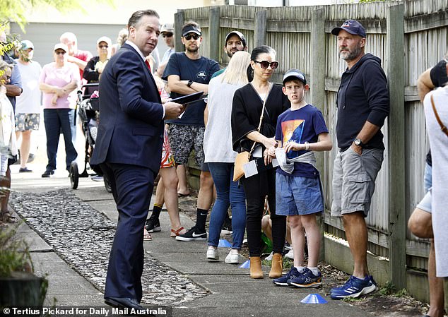 When it came to real estate, Koch said the more affordable capital markets of Brisbane (Coorparoo auction pictured), Adelaide and Perth would be better investments than Sydney or Melbourne in 2024.