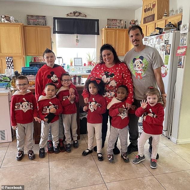 Jerry Lopez, 39, pictured with his seven children - six were placed in foster care and one was adopted - and his wife Karen, was described as a devoted 'family man', was recently promoted and celebrated his 13 years of citizenship from the United States