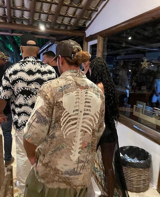 The Formula 1 driver, 38, and the model, 25, were spotted together at a pre-New Year's Eve party in the beautiful coastal town of Transcoso, Brazil