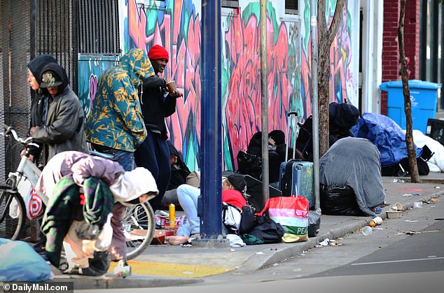 Exclusive photos from DailyMail.com show homeless people filling the streets in San Francisco's Tenderloin District, where vagrants regularly relieve themselves on the sidewalk