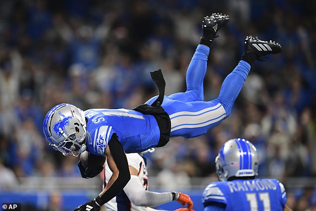 Lions' Amon-Ra St. Brown performed a front somersault over a defender and scored a 15-yard touchdown