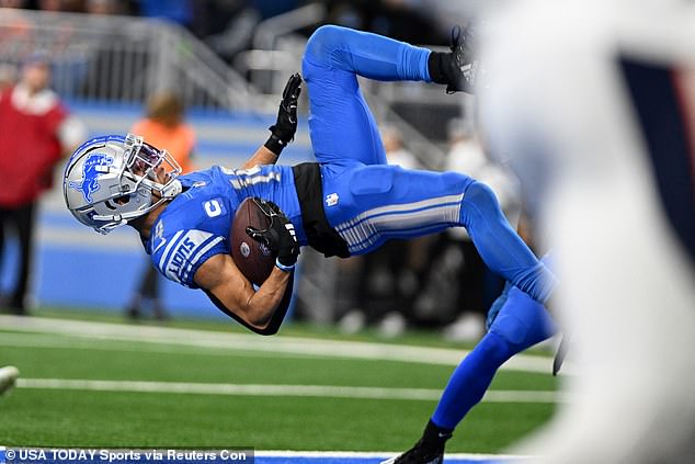 St. Brown landed on his back in the end zone after floating over the tackler