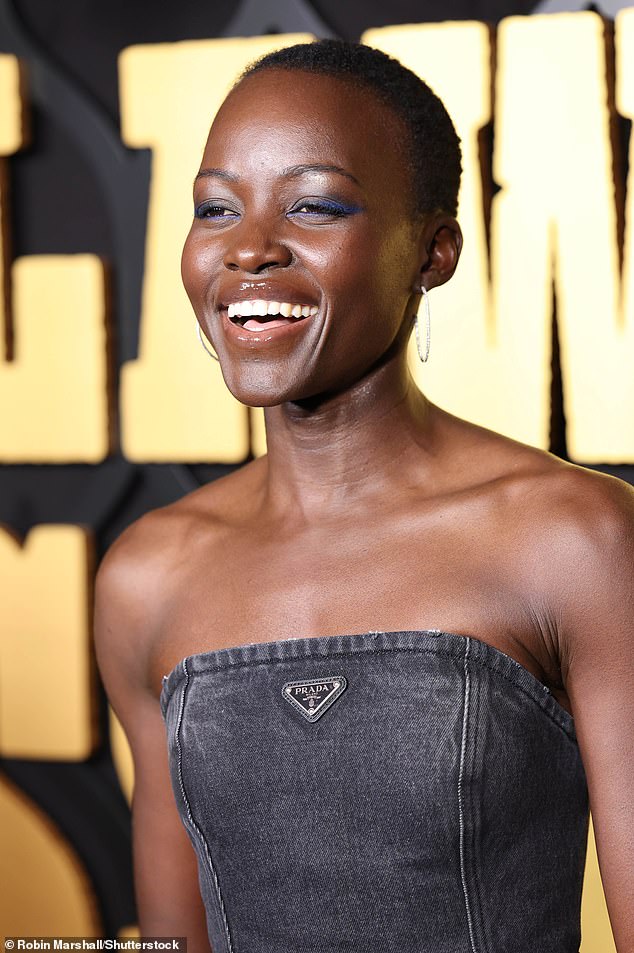 Lupita added a pop of purple eyeshadow to her sleek look