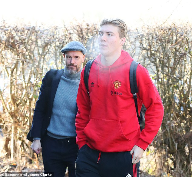 Manchester United manager Erik ten Hag and striker Rasmus Hojlund prepare to board the team bus after their flight to Newcastle was canceled on Saturday morning