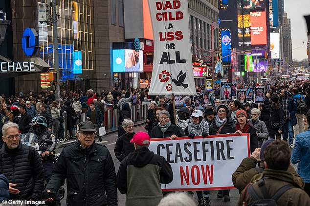 Hundreds of pro-Palestinian protesters marched Thursday in Times Square and then on foot from Zuccotti Park to the World Trade Center