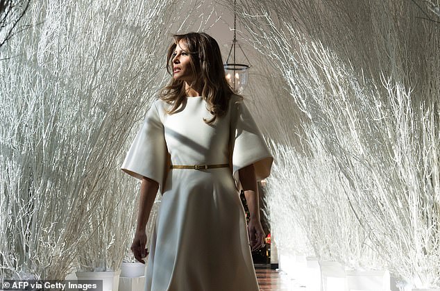 Melania Trump decorated the East Colonnade with dramatic white branches in 2017, her first year serving as first lady.  The photo shoot of her walking down the hallway in her bell-shaped white dress was turned into a meme and labeled as creepy