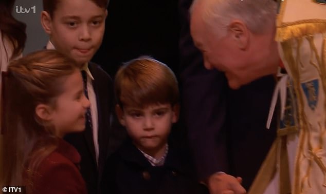 This is the sweet moment Princess Charlotte showed off her good manners as she shared a polite handshake with the clergy