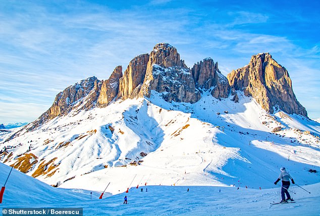 The Alps or the Dolomites?  Mark Palmer says 'it almost feels disloyal to be on the latter's side'.  He stays in the village of Ortisei, close to the famous Sella Ronda (above), 'perhaps the largest ski circuit in Europe'