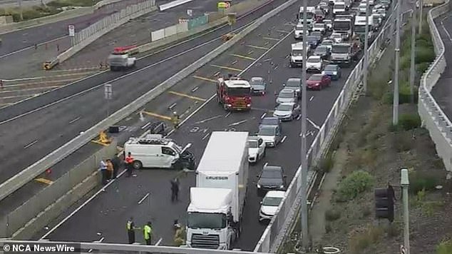 A major crash involving more than 20 vehicles has caused traffic chaos northwest of Melbourne, leaving one person fighting for their life