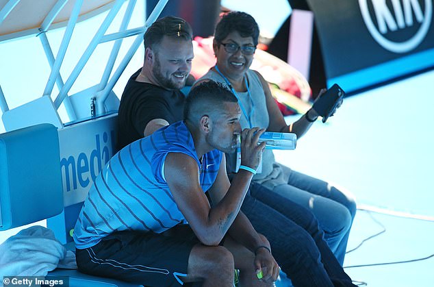 Murray warned John Morris (centre), Kyrgios' manager, and gave him advice after seeing arm injuries