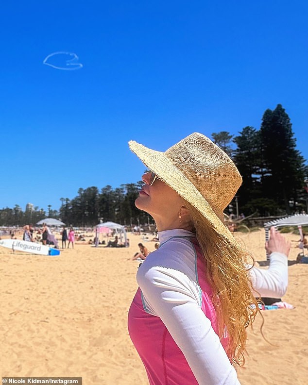 Nicole Kidman (photo) is known for being sun shy.  On New Year's Eve, she rang in 2024 by hitting the sand in a hat, sunglasses and a rashie, also known as a rashie vest