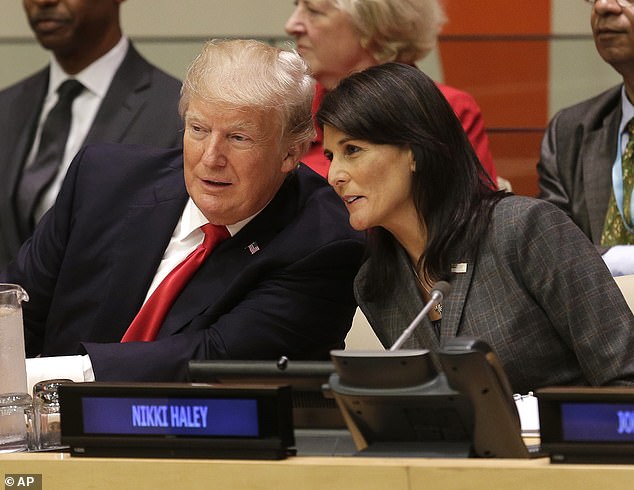 In New Hampshire, the gap between former President Donald Trump and fellow Republican presidential candidate Nikki Haley appears to be narrowing.  They are seen here conferring before a meeting at the United Nations General Assembly in New York in September 2017