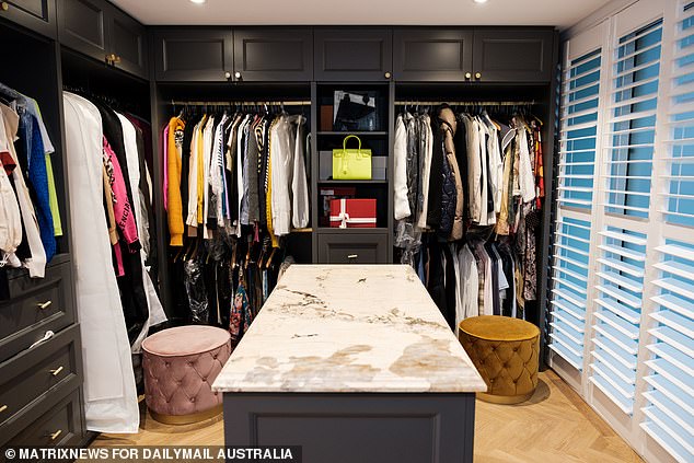 Kate's walk-in closet is filled with her favorite designer clothes and accessories