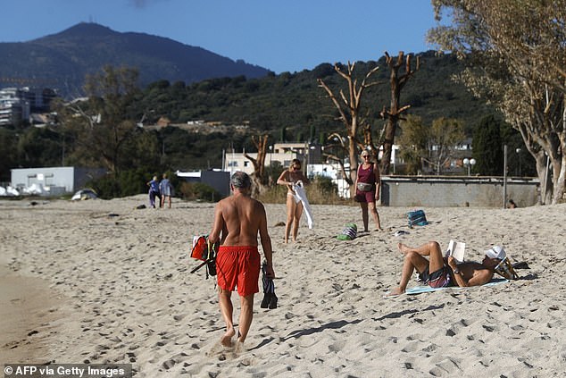 November was the fifth consecutive month of record-breaking temperatures, with the Copernicus Climate Change Service recording the hottest autumn on record.  Pictured: A beach in Corsica on November 20