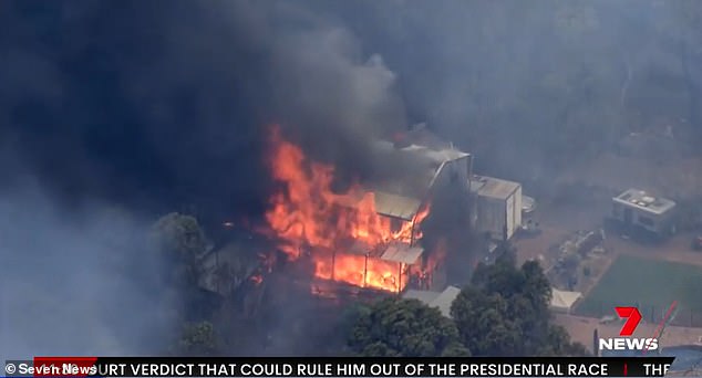 A house in Perth's eastern suburbs has been consumed by fire and authorities have warned people in Parkerville to leave while they still can