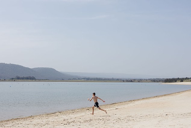 The missing man is believed to have entered the water at Penrith Beach, about 58km west of Sydney, on Boxing Day around 2.35pm (photo, the new man-made beach west of Sydney)