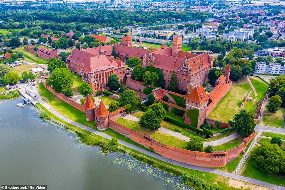 See the largest castle in the world: the Polish Malbork Castle.  This Gothic colossus is spread over 52 hectares (2.27 million square feet)