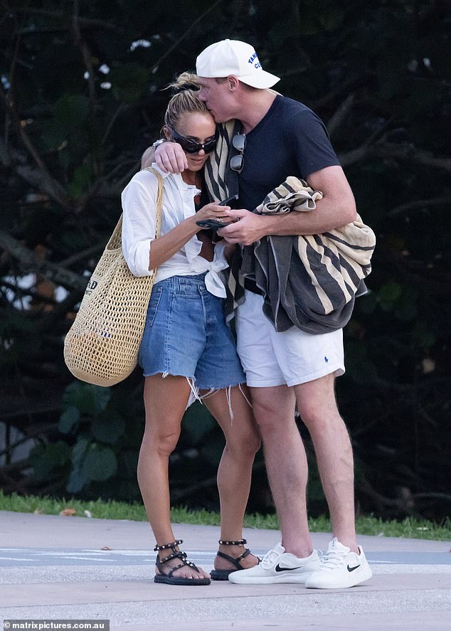 Pip Edwards put on a loving show with a handsome mystery man as the pair cozy up on a quiet outing in Noosa