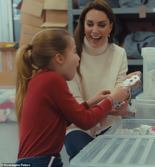 Eight-year-old Princess Charlotte looked adorable as she helped her mum Kate Middleton visit the Windsor Baby Bank with her brothers, wearing a chic £37 red jumper