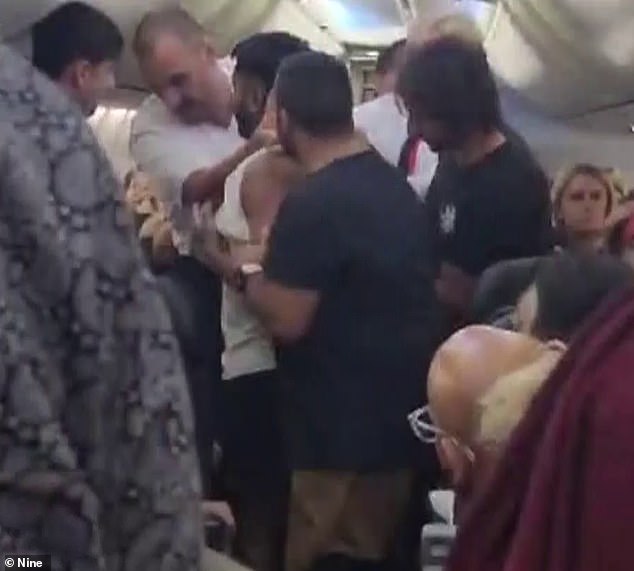 The man had to be restrained by cabin crew after allegedly assaulting a crew member on Qantas flight QF46 between Bali and Melbourne.