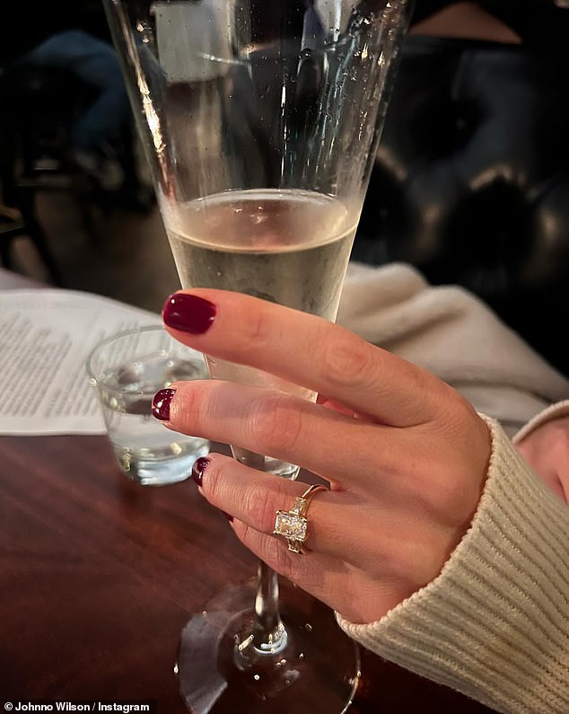 Johnno also posted a close-up of her hand with the huge ring while holding a glass of champagne