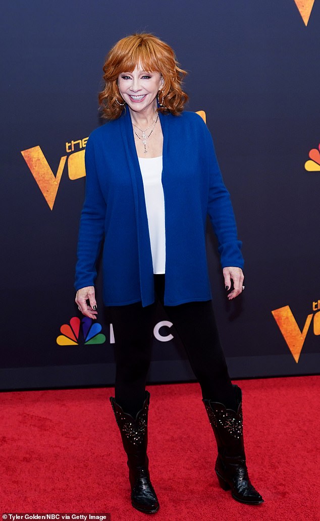 Reba McEntire wore a sparkling ring on a suspicious finger while promoting The Voice on Monday - but the country icon has assured fans it's not what it seems